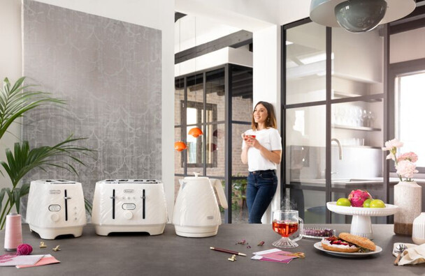 Cream De'Longhi Ballerina kettle and toasters in a bright kitchen breakfast scene